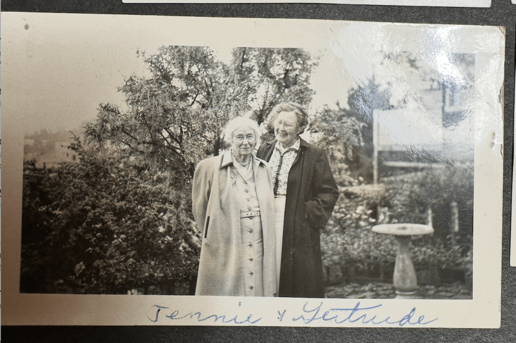 Photo of Jennie & Gertrude standing together smiling.
